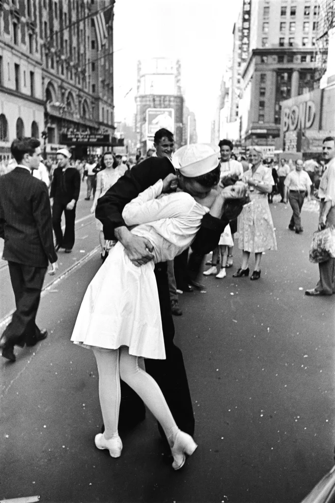 Iconic Kiss to Ironic Twist - Photo shows a Sailor kissing a woman in Times Square New York on V-J Day.