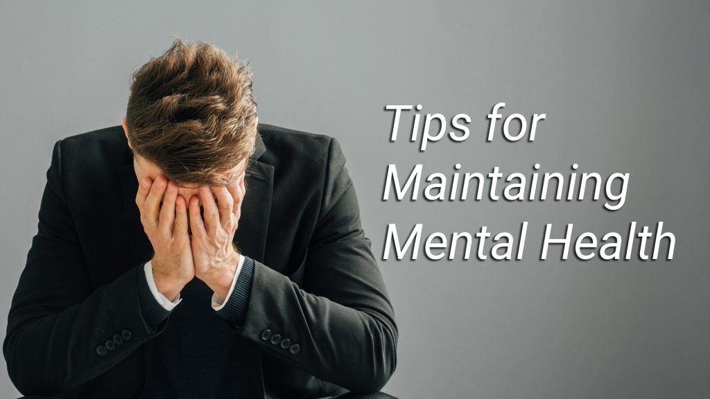 Tips for Maintaining Mental Health - Image shows a man in a suit with his head in his hands